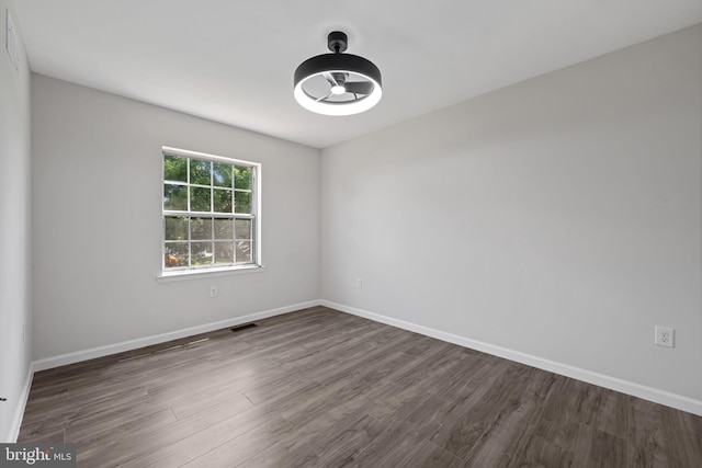 5783 Katsura Ct, Frederick, MD 21703 - empty room with dark wood finished floors and baseboards