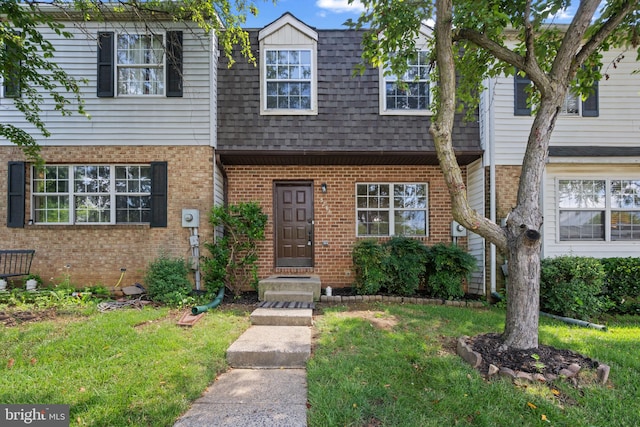 5783 Katsura Ct, Frederick, MD 21703 - multi unit property featuring brick siding, a shingled roof, a front lawn, and mansard roof