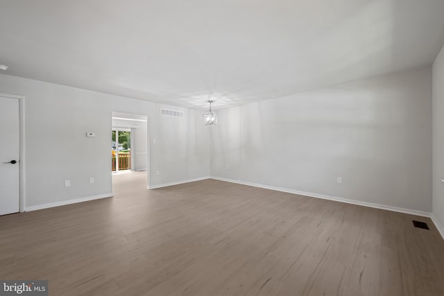 5783 Katsura Ct, Frederick, MD 21703 - spare room featuring wood finished floors and a chandelier