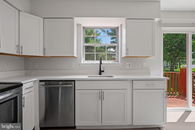 5783 Katsura Ct, Frederick, MD 21703 - kitchen with appliances with stainless steel finishes, white cabinetry, and light countertops