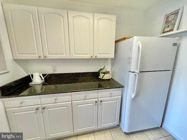 12207 Academy Way Unit 149 7, Rockville, MD 20852 - kitchen with freestanding refrigerator, white cabinetry, and dark stone countertops