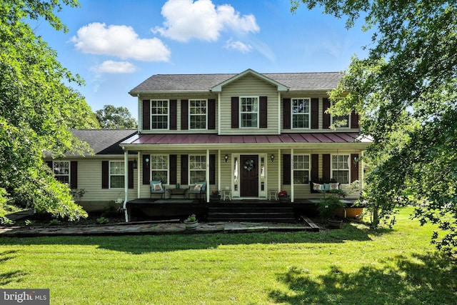 5302 Sumerduck Rd, Sumerduck, VA 22742 - colonial home with a porch, a front yard, a standing seam roof, and a metal roof