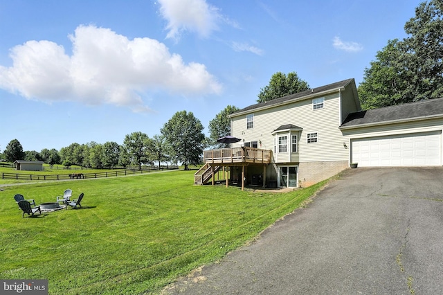 5302 Sumerduck Rd, Sumerduck, VA 22742 - view of yard featuring stairway, a wooden deck, asphalt driveway, an attached garage, and a fire pit