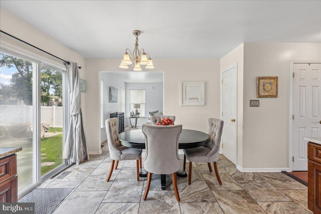 45 Sassafras Dr, Sicklerville, NJ 08081 - dining area featuring a chandelier and baseboards