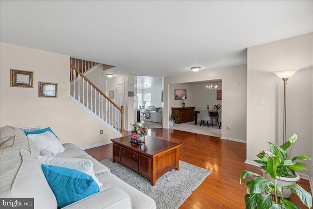 45 Sassafras Dr, Sicklerville, NJ 08081 - living area with a chandelier, stairway, and wood finished floors