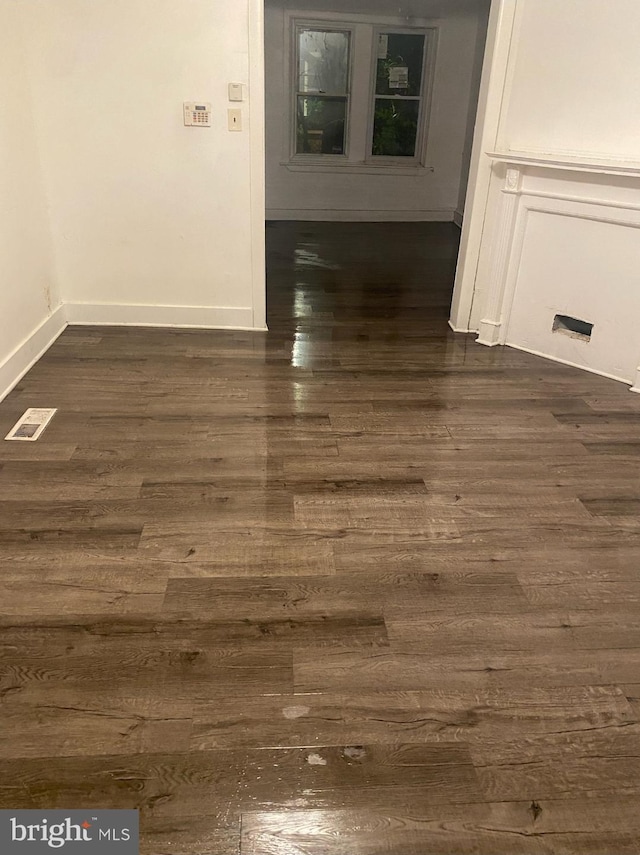 5219 Beaumont Ave, Philadelphia, PA 19143 - empty room featuring dark wood-style flooring and baseboards