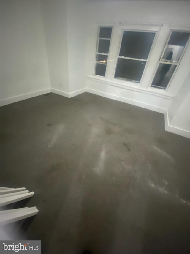 5219 Beaumont Ave, Philadelphia, PA 19143 - spare room featuring concrete flooring and baseboards