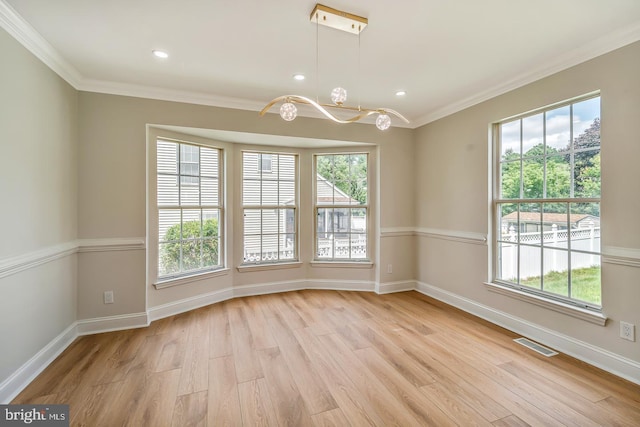 22 Billingsport Dr, Sicklerville, NJ 08081 - spare room featuring a chandelier, light wood-style flooring, plenty of natural light, crown molding, and recessed lighting