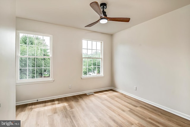 22 Billingsport Dr, Sicklerville, NJ 08081 - unfurnished room with light wood finished floors, plenty of natural light, and a ceiling fan