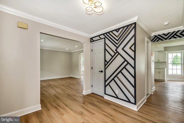 22 Billingsport Dr, Sicklerville, NJ 08081 - empty room featuring light wood-style floors, ornamental molding, and a smoke detector