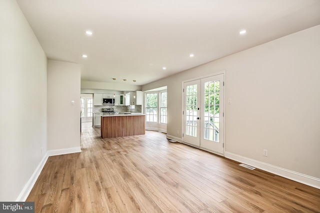 22 Billingsport Dr, Sicklerville, NJ 08081 - unfurnished living room featuring light wood-style flooring and recessed lighting