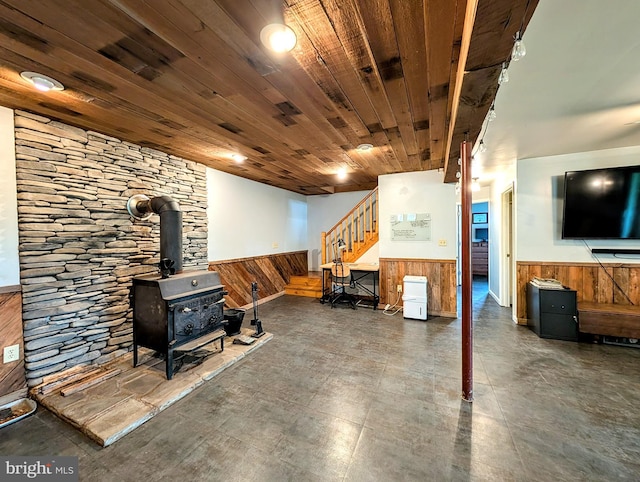 22262 Deer Run, Shade Gap, PA 17255 - living area with wainscoting, stairway, a wood stove, and wooden walls