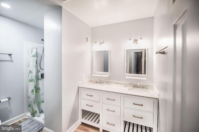 6611 Rosecroft Pl, Falls Church, VA 22043 - full bathroom featuring double vanity and wood finished floors