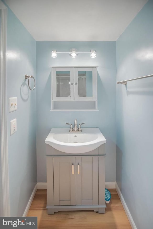 6611 Rosecroft Pl, Falls Church, VA 22043 - bathroom featuring vanity and wood finished floors