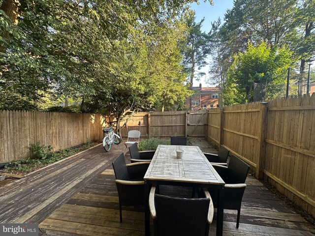 6611 Rosecroft Pl, Falls Church, VA 22043 - wooden deck featuring outdoor dining space and a fenced backyard