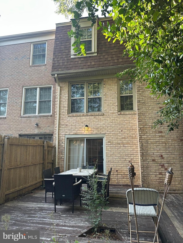 6611 Rosecroft Pl, Falls Church, VA 22043 - back of house with a wooden deck, roof with shingles, brick siding, and outdoor dining space