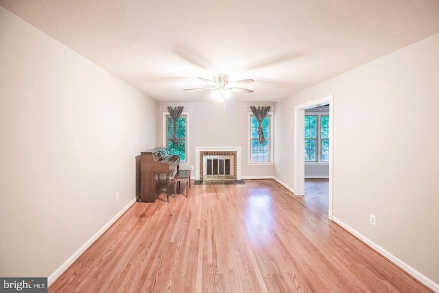 6611 Rosecroft Pl, Falls Church, VA 22043 - unfurnished living room featuring ceiling fan, wood finished floors, and a brick fireplace