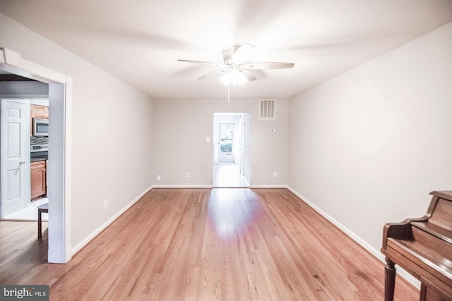 6611 Rosecroft Pl, Falls Church, VA 22043 - empty room with ceiling fan and light wood-style flooring