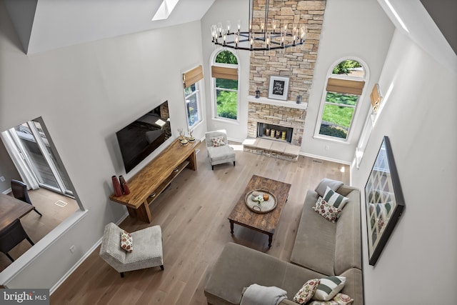 62 Brooks Rd, Moorestown, NJ 08057 - living room with high vaulted ceiling, healthy amount of natural light, a fireplace, a skylight, and wood finished floors