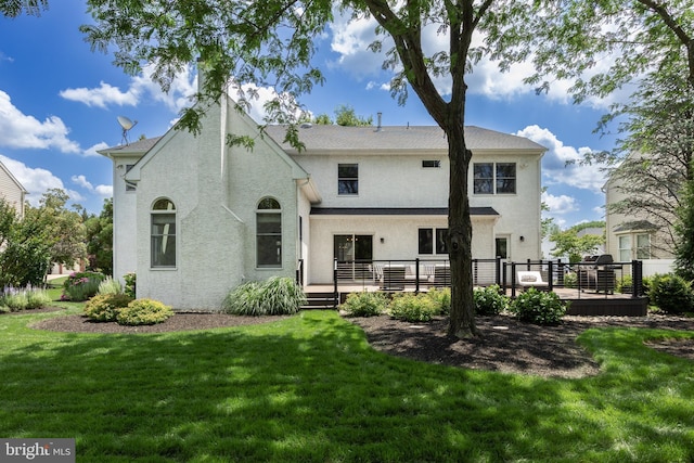 62 Brooks Rd, Moorestown, NJ 08057 - rear view of property with a wooden deck, a lawn, and stucco siding