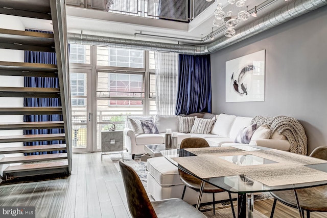 1390 Kenyon St NW Unit 326, Washington, DC 20010 - living room with a towering ceiling and wood finished floors