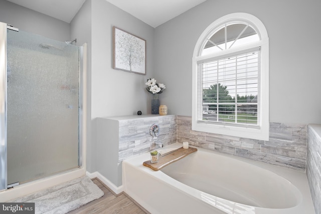107 Heathfield Ct, Middletown, DE 19709 - bathroom with wood finished floors, a shower stall, and a garden tub