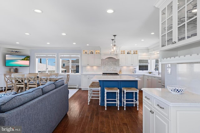 10 11th St, Beach Haven, NJ 08008 - kitchen featuring crown molding, a center island, dark wood finished floors, white cabinetry, and light countertops