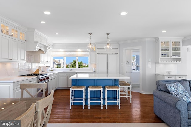 10 11th St, Beach Haven, NJ 08008 - kitchen featuring high end range, recessed lighting, plenty of natural light, a breakfast bar, and white cabinets