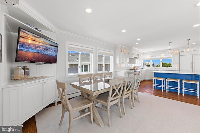 10 11th St, Beach Haven, NJ 08008 - dining space featuring ornamental molding, recessed lighting, wood finished floors, and a baseboard radiator