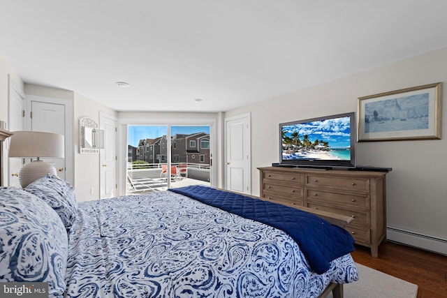 10 11th St, Beach Haven, NJ 08008 - bedroom with access to exterior, a baseboard heating unit, and wood finished floors