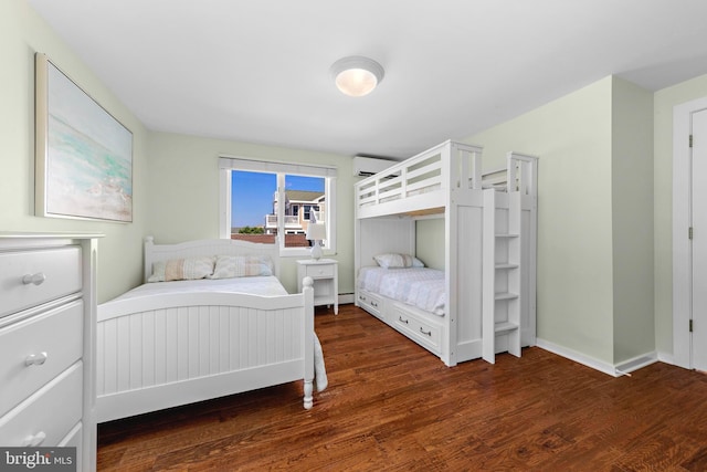 10 11th St, Beach Haven, NJ 08008 - bedroom with a wall mounted air conditioner and wood finished floors