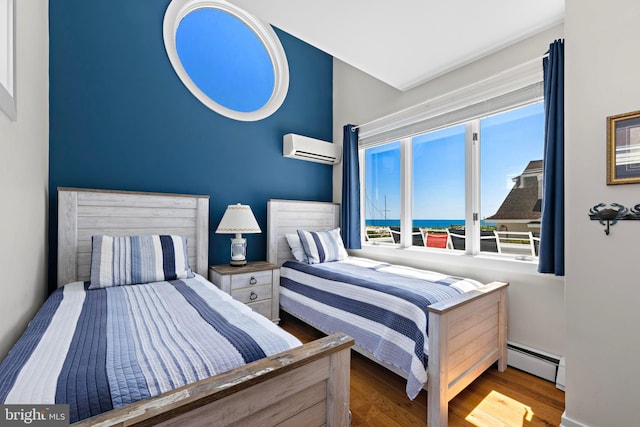 10 11th St, Beach Haven, NJ 08008 - bedroom featuring a wall mounted AC, a baseboard radiator, wood finished floors, and a water view