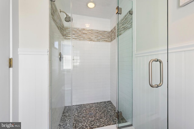 10 11th St, Beach Haven, NJ 08008 - bathroom featuring wainscoting, a shower stall, and a decorative wall