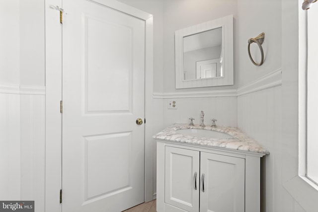 10 11th St, Beach Haven, NJ 08008 - bathroom with vanity, wainscoting, and a decorative wall