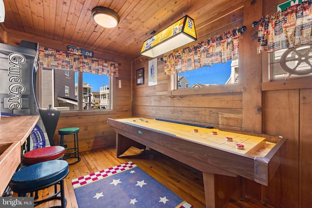 10 11th St, Beach Haven, NJ 08008 - recreation room featuring wood walls, wood-type flooring, plenty of natural light, wood ceiling, and an AC wall unit