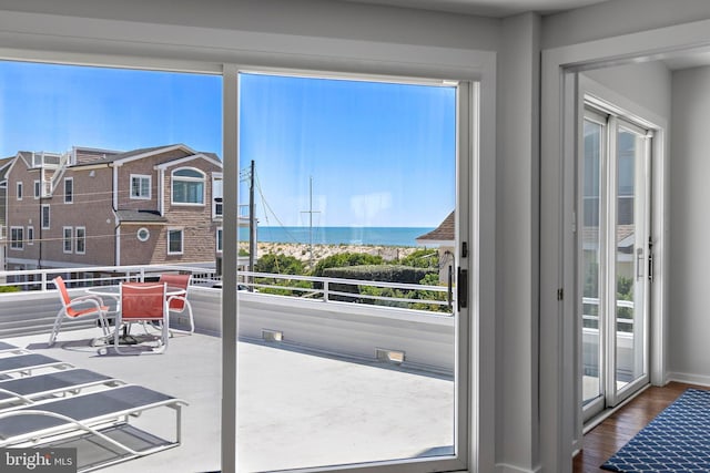 10 11th St, Beach Haven, NJ 08008 - doorway to outside featuring a water view and dark wood-style floors