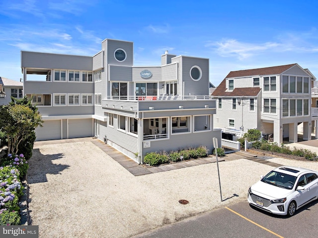 10 11th St, Beach Haven, NJ 08008 - view of building exterior with a garage and uncovered parking