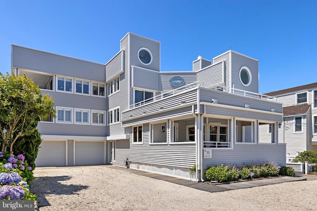 10 11th St, Beach Haven, NJ 08008 - view of front of property featuring an attached garage, driveway, and a chimney