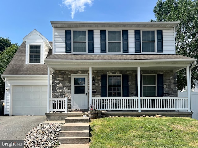 210 W Walnut St, Marietta, PA 17547 - view of front facade with covered porch, a garage, asphalt driveway, stone siding, and a shingled roof