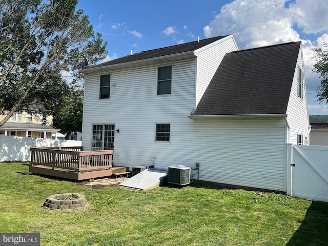 210 W Walnut St, Marietta, PA 17547 - back of property with an outdoor fire pit, a deck, a shingled roof, and a gate