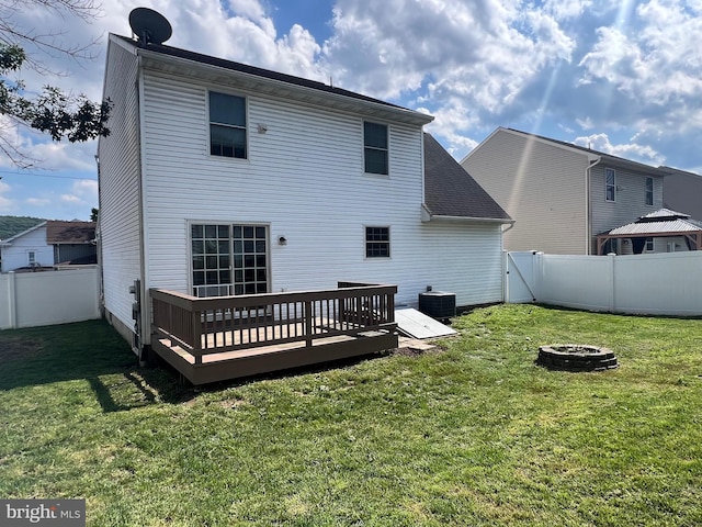 210 W Walnut St, Marietta, PA 17547 - rear view of property with a deck, a fenced backyard, and an outdoor fire pit