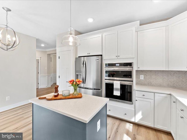 11433 Popes Head Rd, Fairfax, VA 22030 - kitchen featuring appliances with stainless steel finishes, recessed lighting, white cabinetry, light countertops, and decorative backsplash