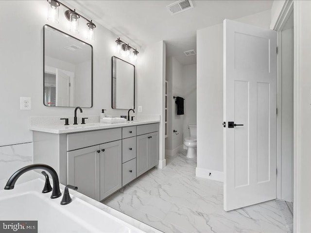 11433 Popes Head Rd, Fairfax, VA 22030 - bathroom with marble look tile flooring and double vanity
