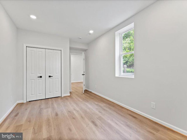 11433 Popes Head Rd, Fairfax, VA 22030 - unfurnished bedroom featuring light wood-type flooring, a closet, and recessed lighting