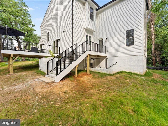 11433 Popes Head Rd, Fairfax, VA 22030 - rear view of property with stairs, a wooden deck, and a lawn