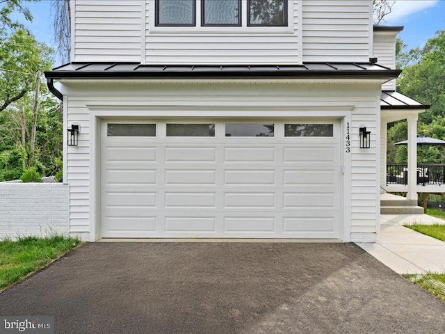 11433 Popes Head Rd, Fairfax, VA 22030 - garage with asphalt driveway