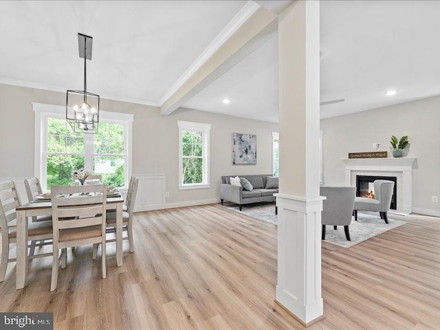 11433 Popes Head Rd, Fairfax, VA 22030 - dining space featuring light wood-style floors, ornamental molding, a chandelier, a glass covered fireplace, and recessed lighting