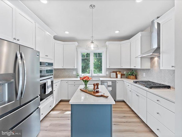 11433 Popes Head Rd, Fairfax, VA 22030 - kitchen featuring stainless steel appliances, wall chimney range hood, white cabinets, and recessed lighting