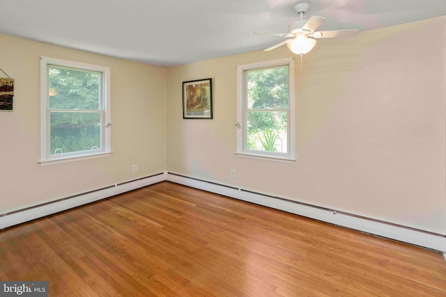 803 Libby Ln, Langhorne, PA 19053 - spare room featuring plenty of natural light, wood finished floors, ceiling fan, and baseboard heating