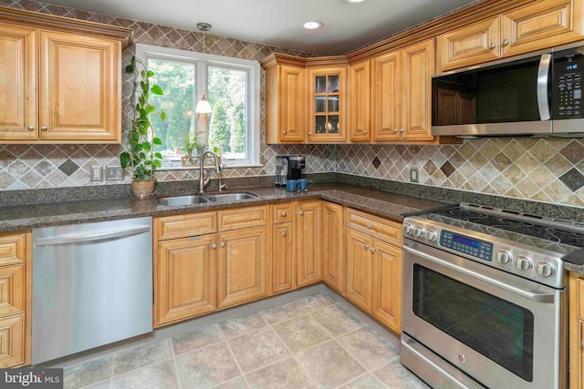803 Libby Ln, Langhorne, PA 19053 - kitchen with stainless steel appliances, backsplash, dark stone counters, and glass insert cabinets